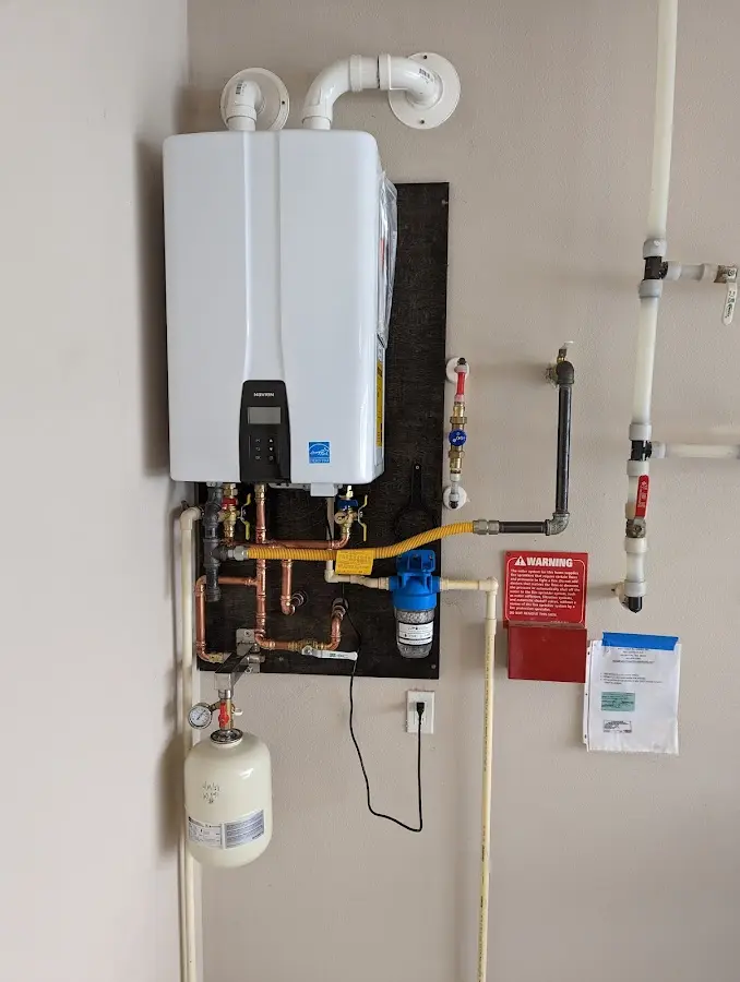 Professional plumber installing copper piping in a Fernandina Beach home